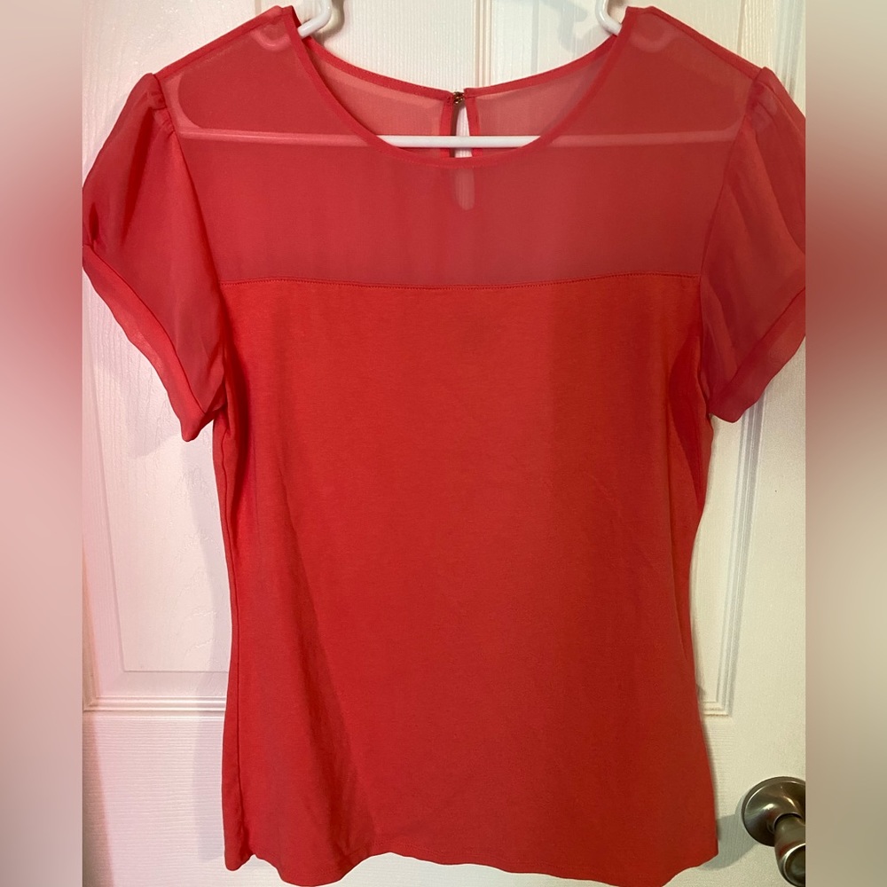 Express Dressy Top Coral with Knot detail on sleeves. Sheer up top size medium.